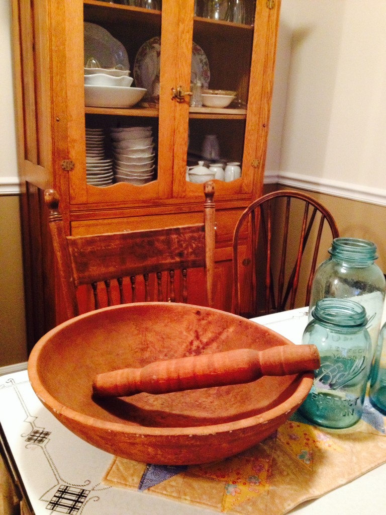 My great-great grandma's dough bowl and rolling pin. Sitting on my great-grandma's enamel kitchen table in front of my other great-grandmother's pie safe. 